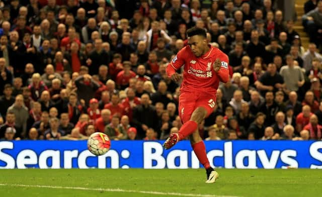 Substitute Daniel Sturridge scores Liverpools third goal  and his 50th for the club  as Jurgen Klopps men took the Merseyside derby honours at Anfield last night. Picture: PA