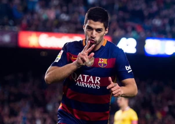 Luis Suarez celebrates after scoring Barcelona's sixth goal against Sporting Gijon. Picture: Alex Caparros/Getty Images