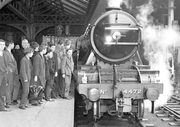 Passengers queue for the spring holiday special train at Waverley Station in April 1966