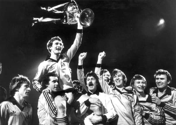 McAlpine celebrating a League Cup win at Dens Park. Picture: TSPL