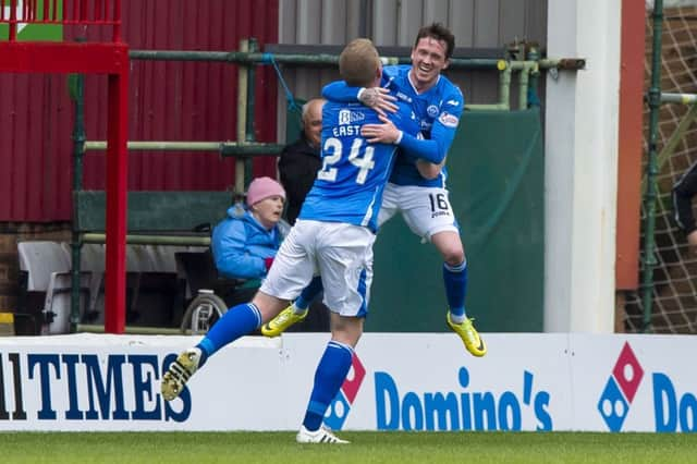 Danny Swanson celebrates scoring St Johnstone's winner with his team mate Brain Easton. Picture: Alan Harvey/SNS