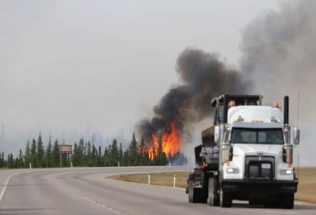 Canada's wild fires in Fort McMurray have parallels with the financial markets. Picture: Getty