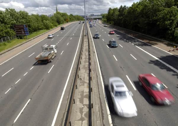 A man was struck and killed by a bus on the M8 after having jumped out of a moving taxi. Picture: TSPL