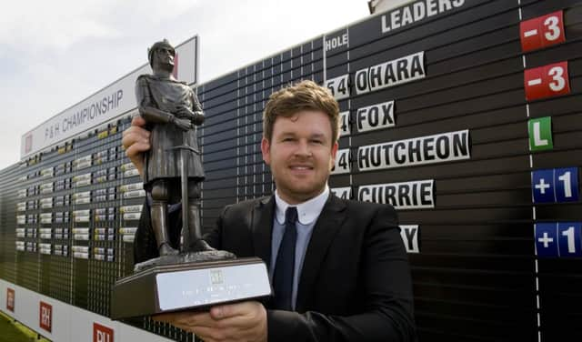 Paul O'Hara shows off the P&H Championship trophy after his victory at The Renaissance Club. Picture: Brian Stewart