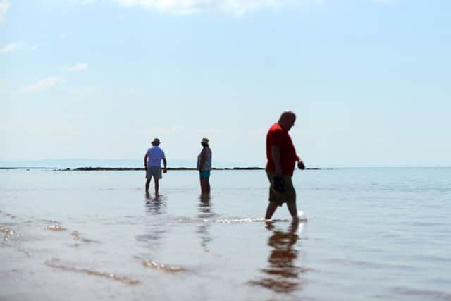 People cool off at the beach in West Kilbride, Ayrshire. Picture: SWNS