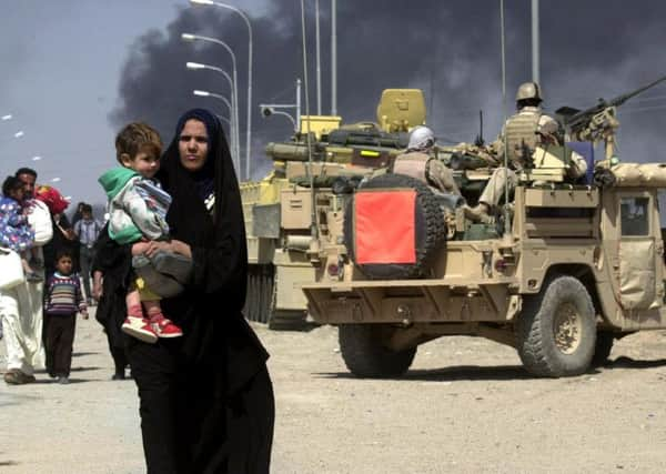 Residents flee the Iraqi city of Basra in March 2003. Picture: PA/PA Wire