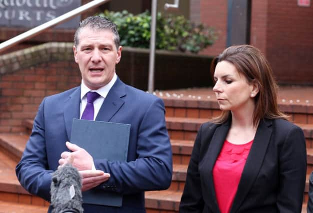 Steve Woliter and DS Kim Jackson of Northamptonshire police read a statement outside court. Picture: SWNS