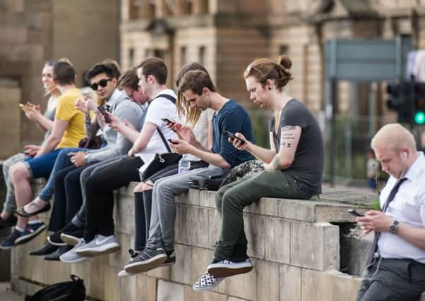 This bridge in Glasgow has become a Pokemon-Go hotspot, players travelling long distances to catch 'em. Picture: John Devlin