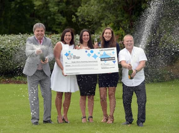 Â£61m winners Keith Reynolds, Sonia Davies, Stephanie Davies, Courtney Davies and Steve Powell. Picture: PA