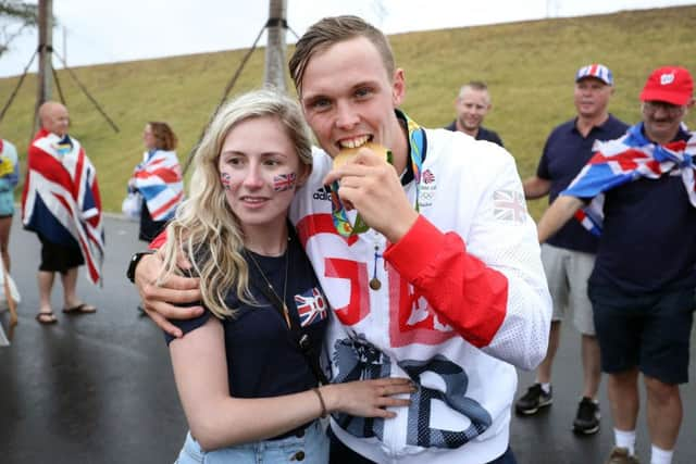 Britain's Joe Clarke celebrates gold in the Kayak K1 with his girlfriend Charlotte Eddery-Joel. Picture: Martin Rickett/PA Wire