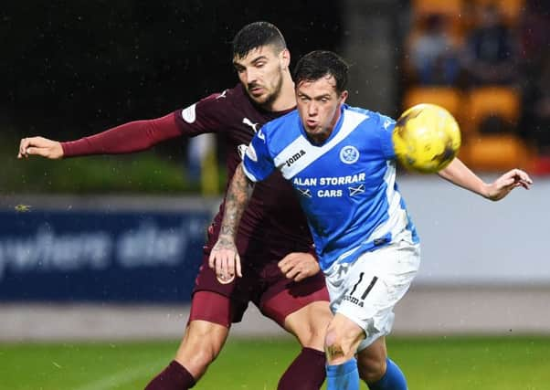 Hearts' Callum Paterson puts in a battling peformance against St Johnstone's Danny Swanson. Picture: Paul Devlin/SNS