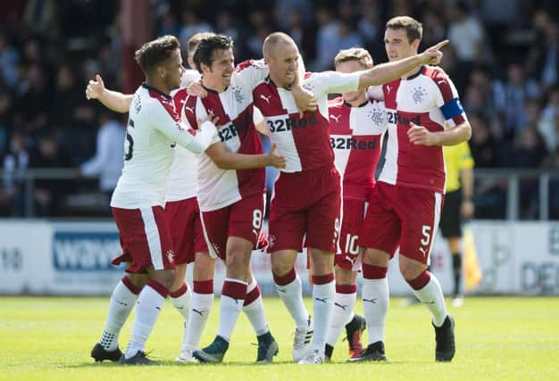 Rangers celebrate Kenny Miller's goal to put them two goals ahead. Picture: SNS