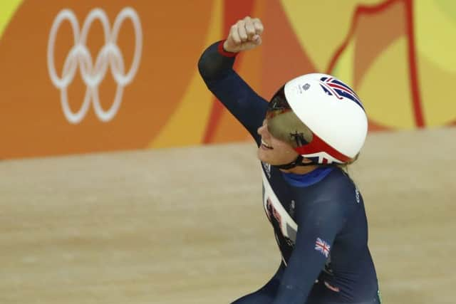 Trott punches the air after her points race win sealed an imperious omnium performance