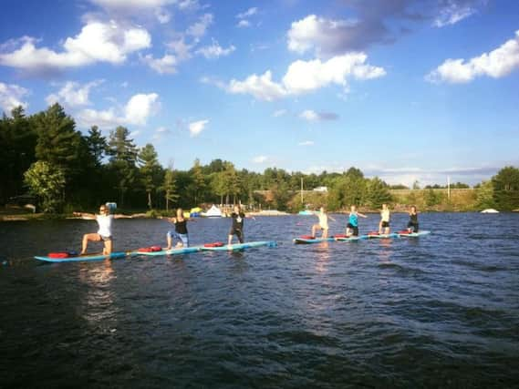 Swap your yoga mats for paddleboards with Scotland's newest fitness craze. Picture: Sattva Wellness