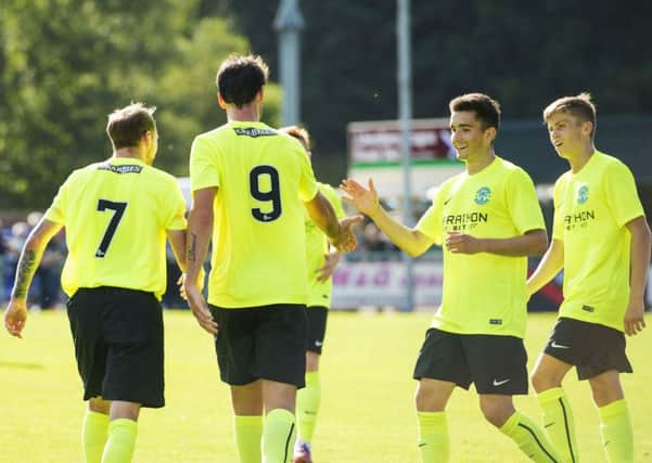 Hibernian's Martin Boyle celebrates his goal with team mates during the win over Turriff United. Picture: Gary Hutchison/SNS