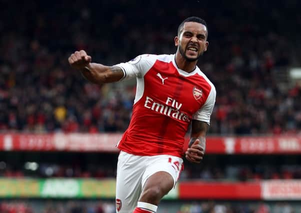 Theo Walcott celebrates scoring against Swansea City. Picture: Getty