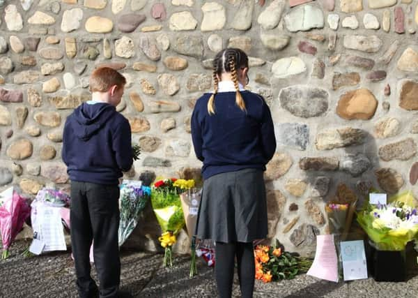 Children stand at the Aberfan memorial garden wall on a day of events to mark the 50th anniversary of the disaster. Picture PA