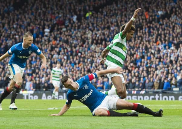 Lee Wallace makes a terrific challenge on Scott Sinclair. Picture: SNS