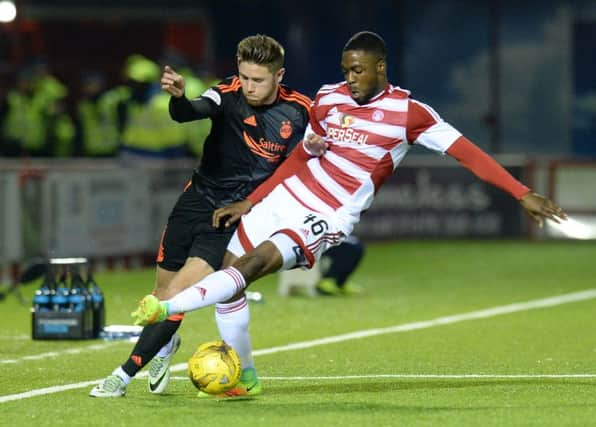 Aberdeen's Wes Burns, left, battles for the ball against Hamilton defender Lennard Sowah. Picture: SNS Group