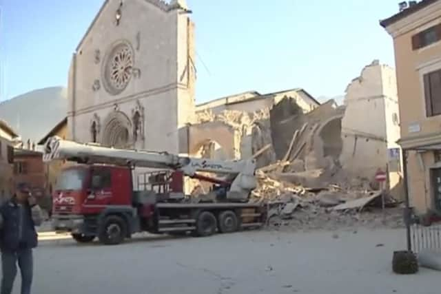 A man stands in front of a damaged church in Norcia. Picture: AP