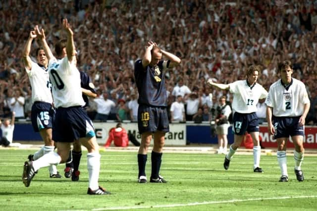 McAllister is surrounded by white shirts but alone in his own horror after his penalty was saved. Picture: Shaun  Botterill/Allsport