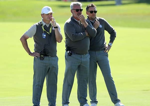 European Ryder Cup captain Darren Clarke, centre, with vice-captains Paul Lawrie, left, and Ian Poulter at Hazeltine. Picture: David Cannon/Getty Images