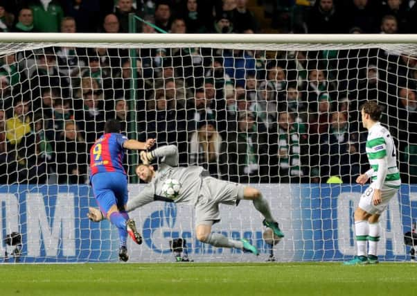 Craig Gordon denies Luis Suarez with a terrific save not long before half-time. Picture: PA