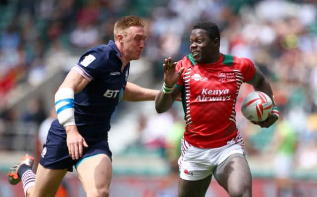 Scotlands Dougie Fife closes in on Alex Olaba of Kenya during a pool match at Twickenham. Picture: Getty