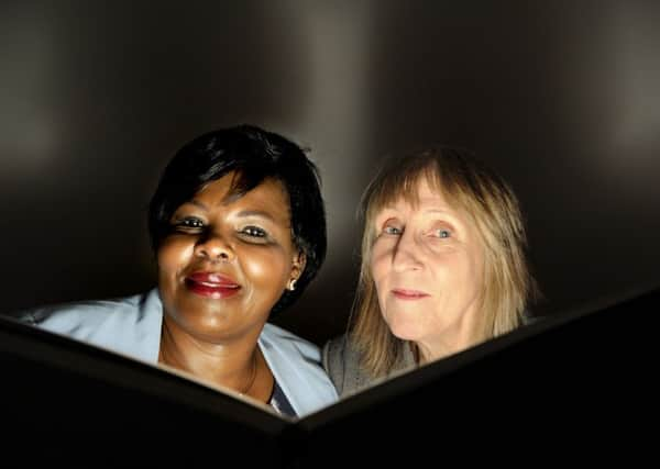 Joyce Onuonga (left) and Tio White of Kingdom Innovative Technologies who have designed a new solar lamp and mobile phone charger for homes in the developing world. PIC  Colin Hattersley Photography.