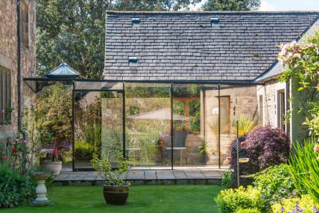 The sun room links the new extension with the original part of the house