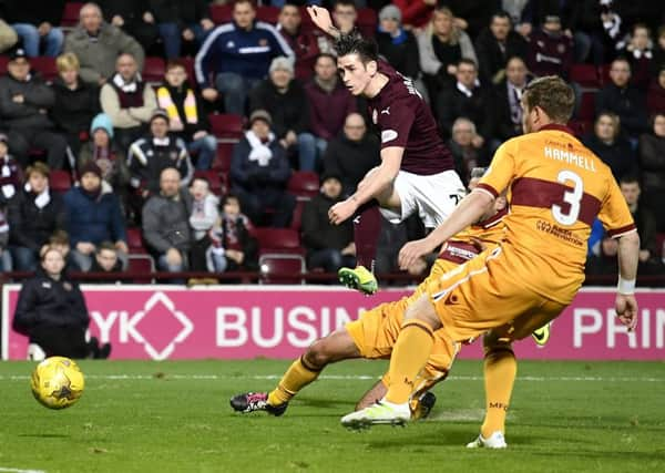 Jamie Walker fires home Hearts third goal in yesterdays comfortable victory at Tynecastle. Picture: Rob Casey/SNS