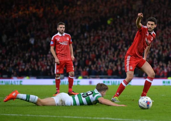 Anthony O'Connor, right, fouls James Forrest inside the penalty area. Picture: Getty