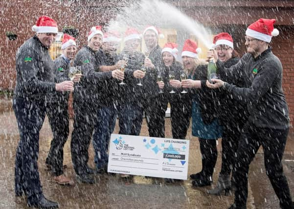 Graeme Lacey, Bruce Richards, Darren Graham, Gareth Dack, John Cunningham, Philip Souter, Colleen Mallis, Louise Robertson, Gail Brown and Stephen Robertson celebrate the win. Picture:: Graeme Hart/Camelot/PA Wire