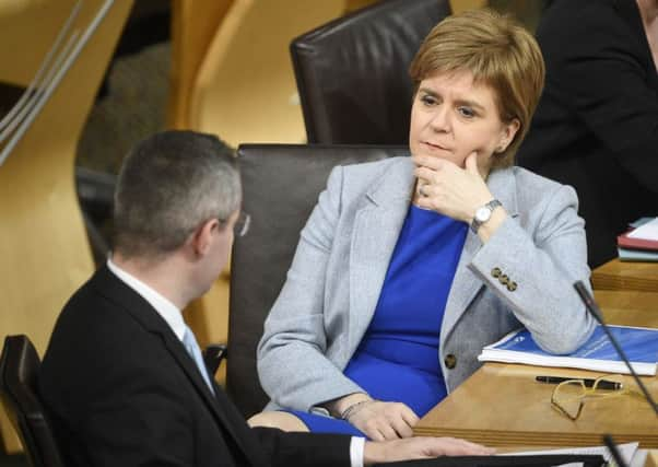 First Minister Nicola Sturgeon with Finance Secretary Derek Mackay. Picture: Greg Macvean