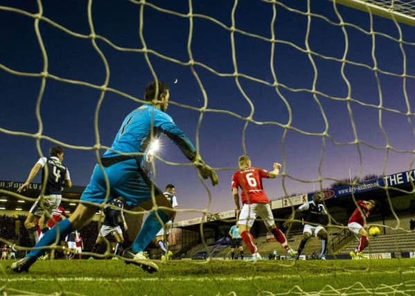 Dunfermline's Lee Ashcroft, right, scores his side's second goal in the 2-0 win over Raith Rovers. Picture: Craig Foy/SNS