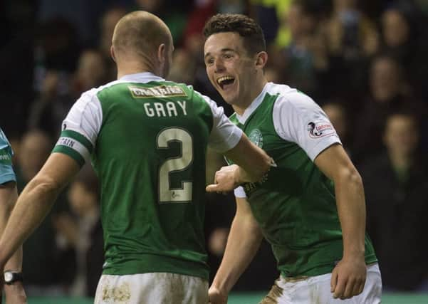 John McGinn celebrates scoring Hibs' third goal with captain David Gray. Picture: Craig Foy/SNS