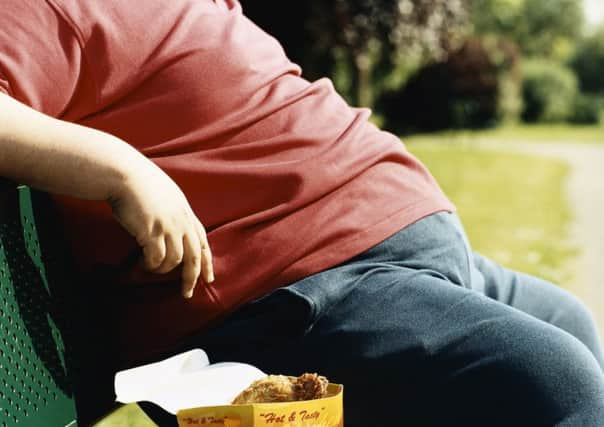 A man eating takeaway food. Picture: PA Photo/JupiterImages Corporation.