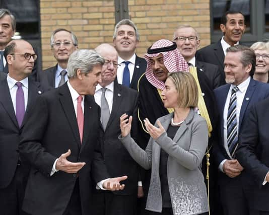 US Secretary of State John Kerry speaks with European Union Foreign Policy Chief Federica Mogherini. Picture; PA