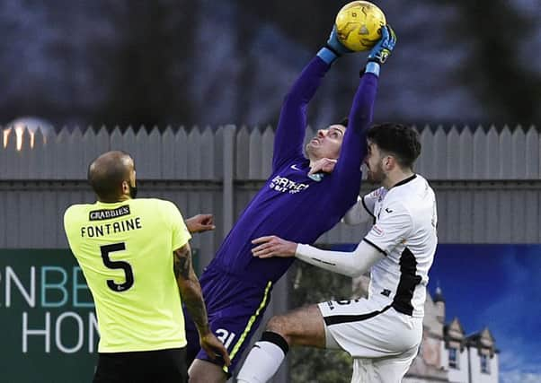 Ross Laidlaw clutches a high ball as he keeps a clean sheet during Hibernians victory at Dumbarton. Picture: SNS.