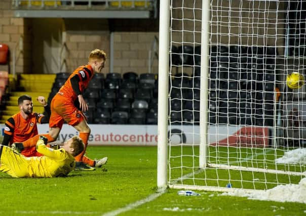 Dundee Uniteds Simon Murray scores a late equaliser to make it 3-3 and salvage a point. Picture: SNS.