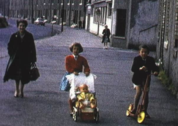 Still from a cine film of Bothwellhaugh, the village that now lies beneath the loch of Strathclyde Country Park, Lanarkshire. The film was made by Joe Griffiths and has been restored by the Scottish Film and Television Archive.