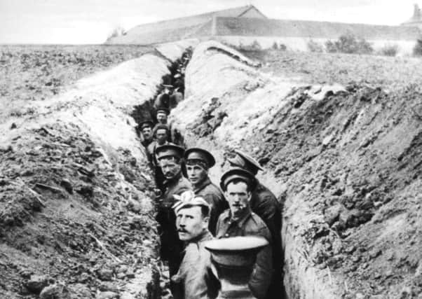 28th October 1914:  British soldiers lined up in a narrow trench during World War I.  (Photo by Hulton Archive/Getty Images)