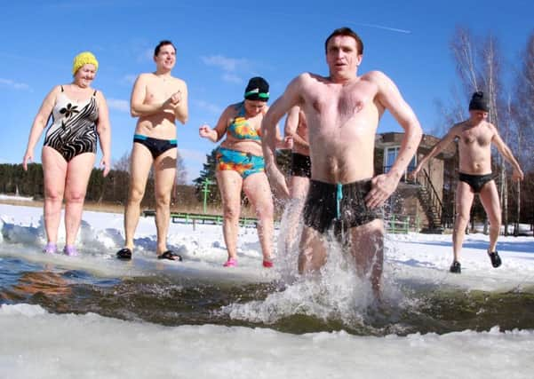 Scotlands first ice swimming championships has just booked up with 80 people from around the world preparing to take the plunge at Loch Lomond.  AFP PHOTO / PETRAS MALUKAS