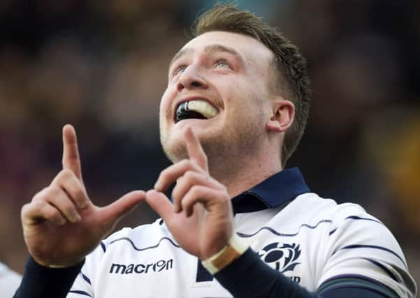 Scotland full-back Stuart Hogg always acknowledges his late friend Richard Wilkinson, who died in a road accident, with a W sign after he scores a try. Picture: Paul Devlin/SNS