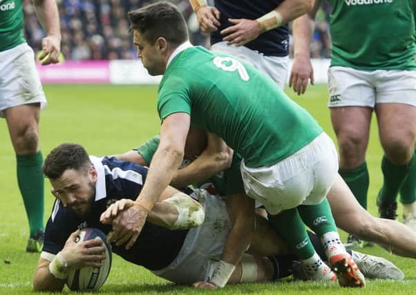 Alex Dunbar  scores Scotland's third try against Ireland.