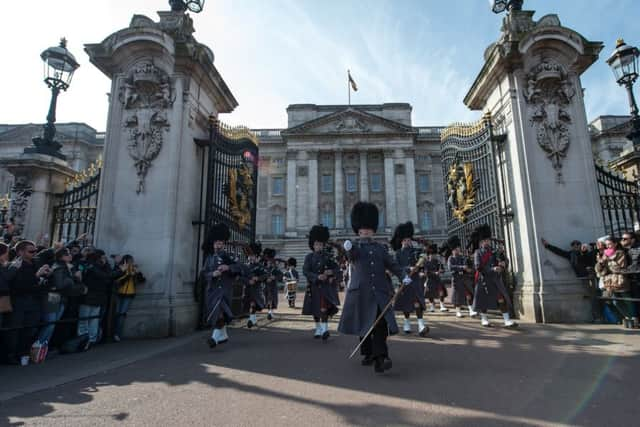 The Scots Guards Pipes and Drums while Changing the Guard at Buckingham Palace. 
Picture: PA