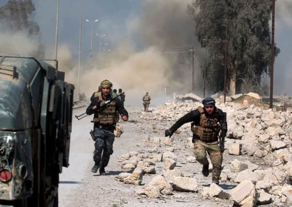 Smoke and dust rise as Iraqi forces attack Mosul airport during an offensive to retake it from Islamic State militants. Picture: AFP/Getty Images