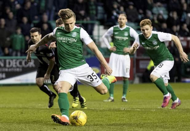 Hibs Jason Cummings scores from the penalty spot to put his team two goals in front. Picture: SNS.