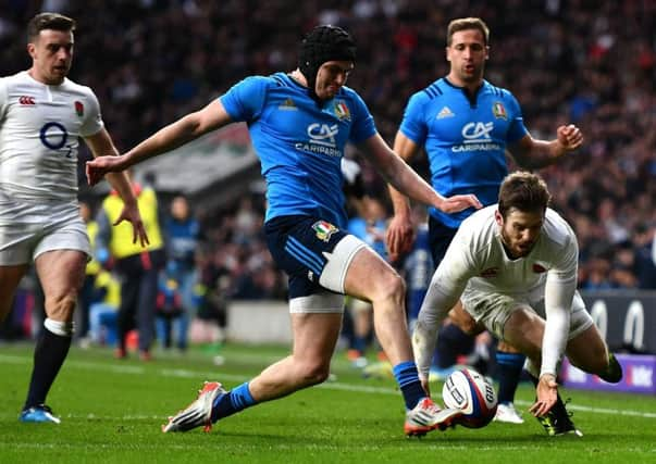 Italian Carlo Canna denies Englands Elliot Daly a second-half try. Picture: Getty.