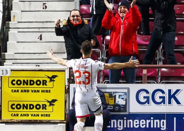 Ross County's Alex Schalk celebrates opening the scoring for the away side. Picture: SNS